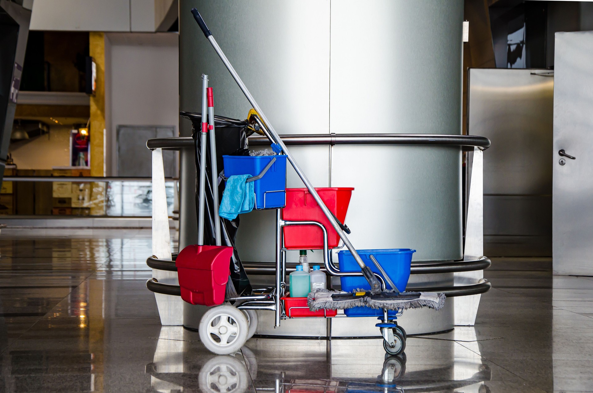 Cleaner cart in a public place. Mobile cart with cleaning products